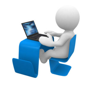 little white human in a modern desk with laptop