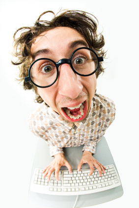 Portrait of funny man screaming during typing a document